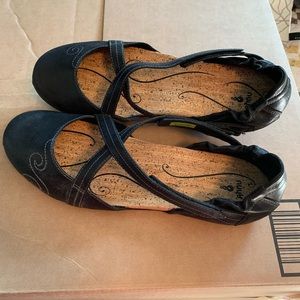 Ahnu woman’s MaryJane style leather flats.